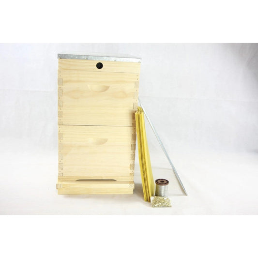 Wooden bee hive frame with a metal base on a white background