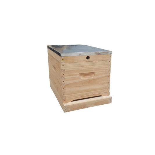 Wooden beehive box with metal top on a white background