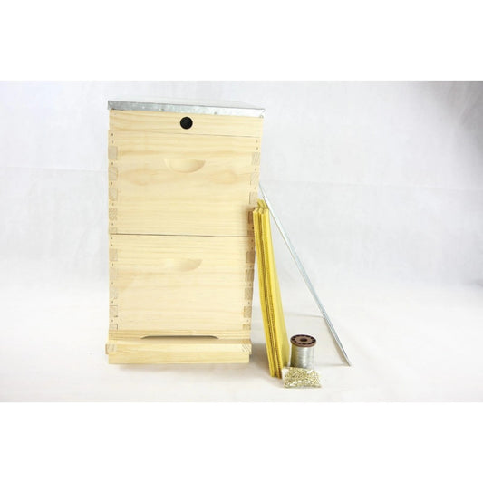 Wooden bee hive frame with a metal base on a white background